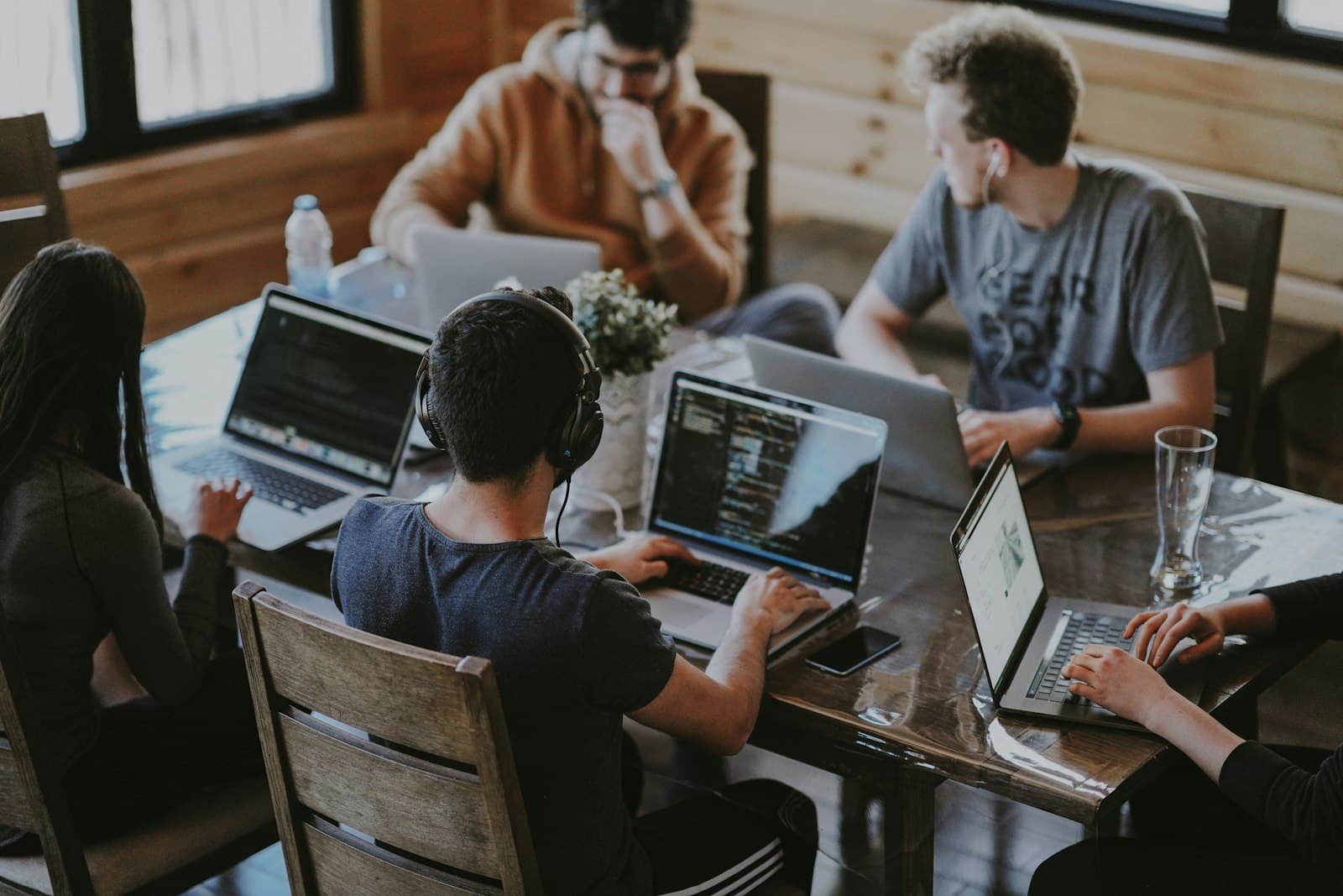 Deal team seated around a conference table